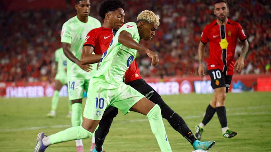 Champions Barcelona ease to opening win at Mallorca