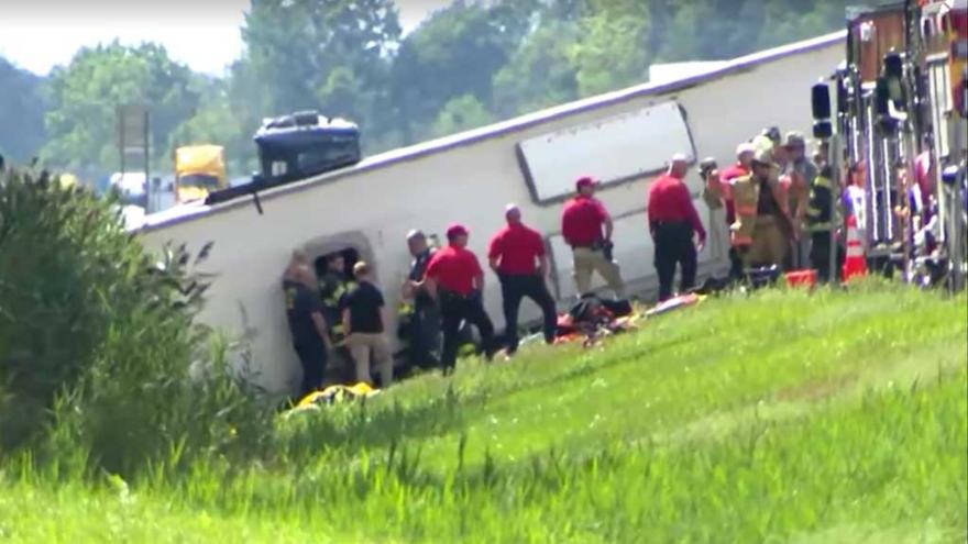Tour bus rolls over on New York highway, killing 5 and injuring dozens