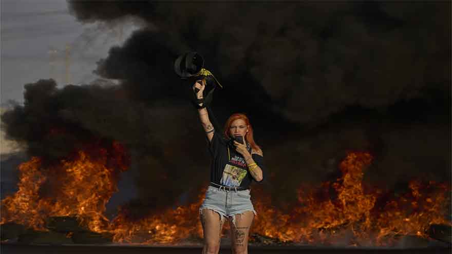 Protesters in Israel demand release of hostages as Gaza strikes kill 16, hospitals say