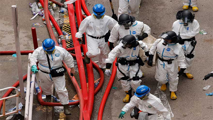 Police comb fire-ravaged Hong Kong apartments, death toll at 151