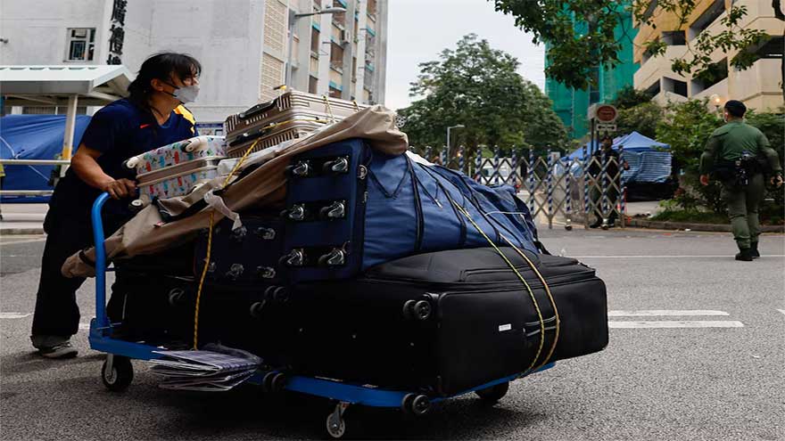 A week after Hong Kong's deadly fire, some residents return for belongings