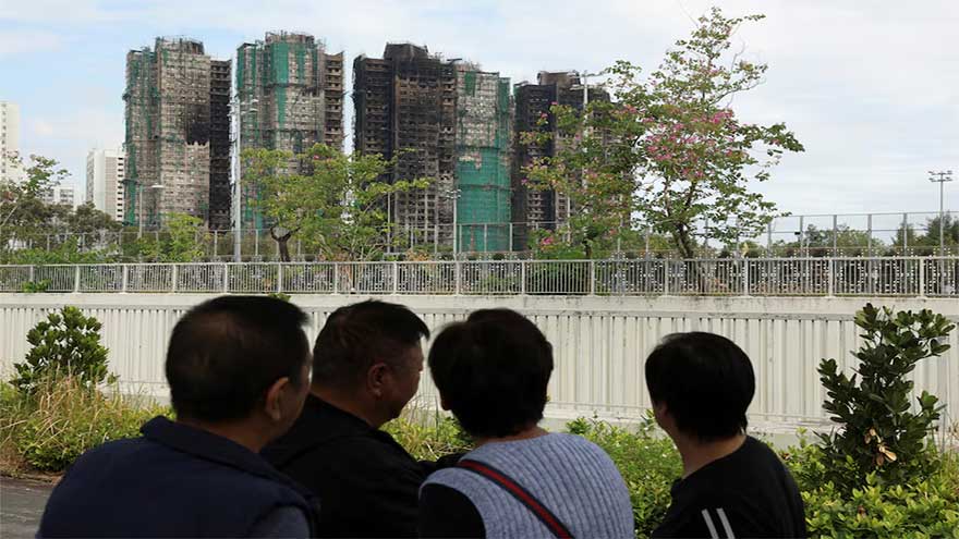 A week after Hong Kong's deadly fire, some residents return for belongings