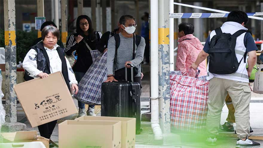 A week after Hong Kong's deadly fire, some residents return for belongings