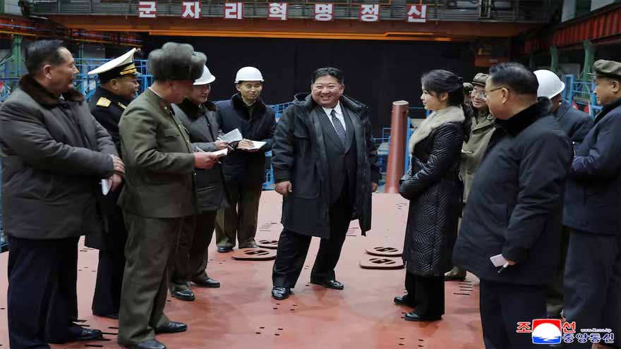 North Korea's Kim Jong Un views submarine construction, oversees missile launch, KCNA says