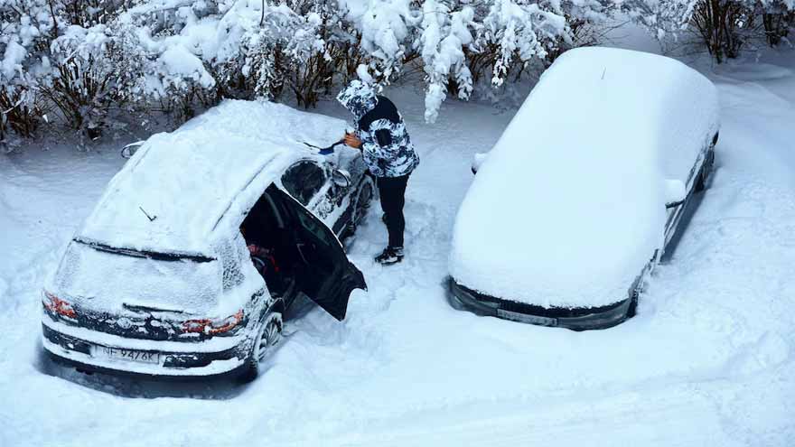 Heavy snow in Poland leaves drivers stranded in tailbacks of up to 20 km
