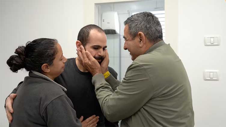 Israeli hostage's release brings some relief for family but fate of wife, children unknown