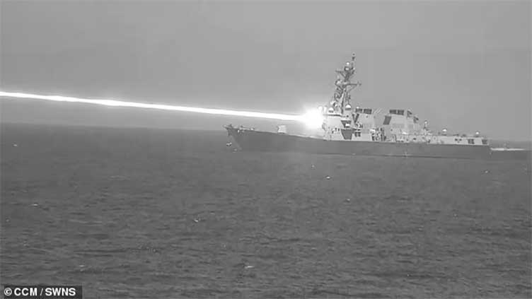 Incredible images capture US Navy testing its new laser weapon