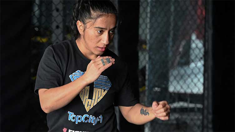 Pioneering Pakistan woman MMA fighter breaks barriers... and arms