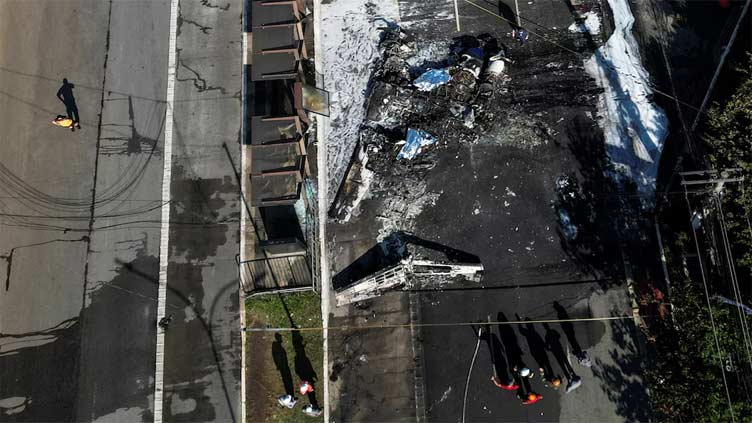 Two dead as small plane crashes into bus on busy Sao Paulo avenue