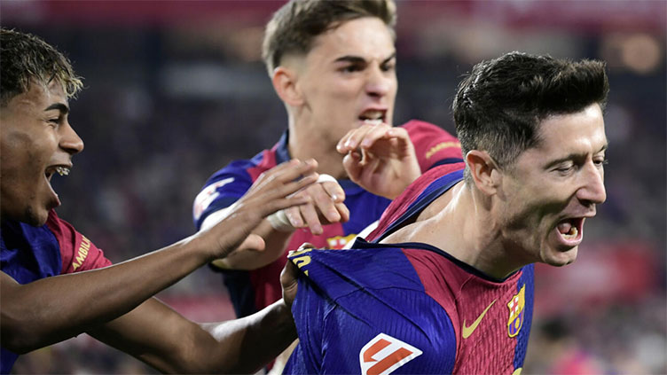 Barca rout Sevilla to maintain title charge