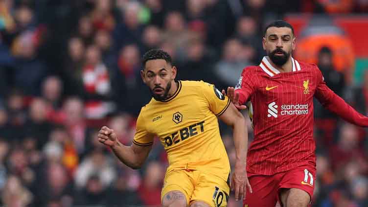 Liverpool edge past Wolves to go seven points clear at top