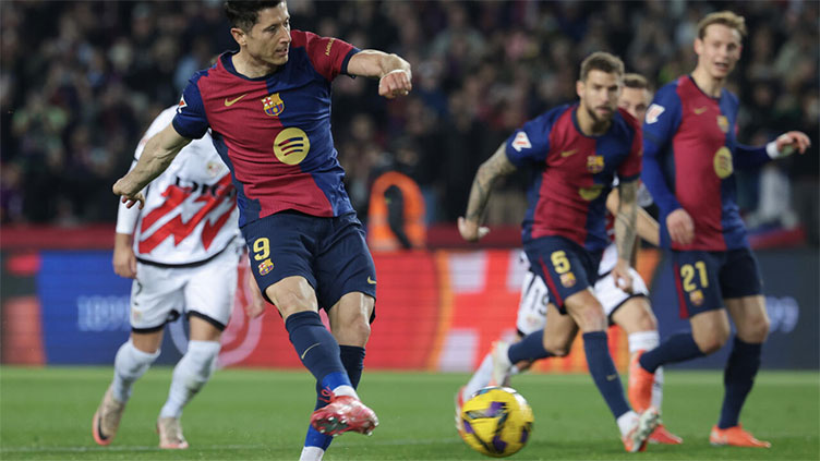 Lewandowski lifts Barcelona past Rayo and into Liga lead