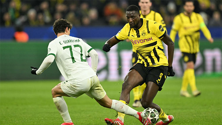 Dortmund ease into Champions League last 16 after Sporting stalemate