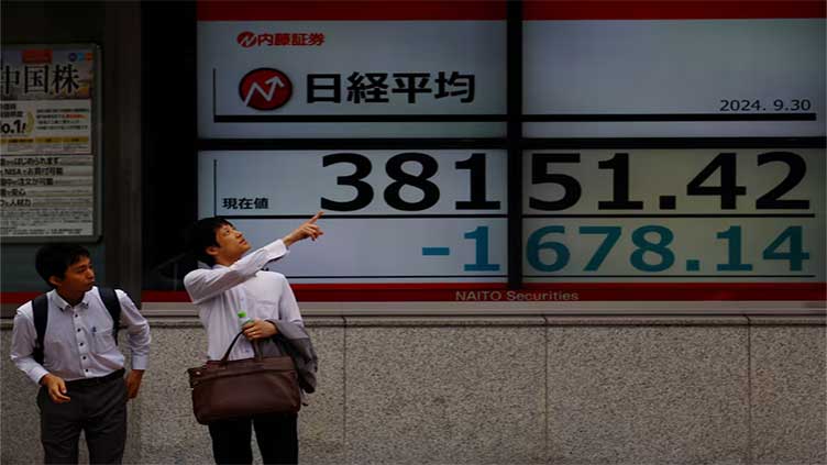 Asian shares slide on US curbs on China, euro gives up gains