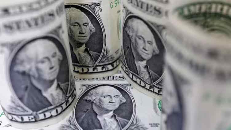 US dollar wallows near 11-week low amid soft economic data