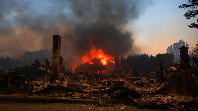 Los Angeles wildfires spread to Hollywood as 100,000 ordered to evacuate