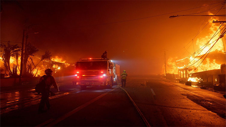 Massive Los Angeles fires rage on even as Hollywood blaze retreats