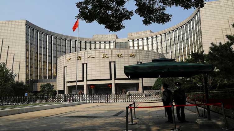 China to cut pay by half for staff at top financial regulators