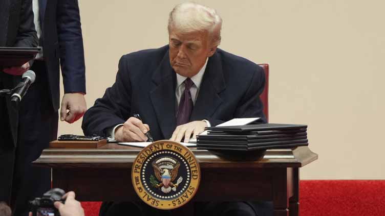 Trump signs executive order directing US withdrawal from the Paris climate agreement — again