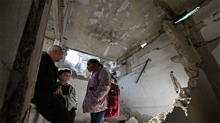 Syrians return to homes devastated by war