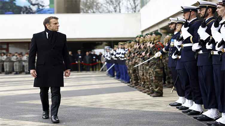 Wake up and spend more on defense, Macron tells Europe as Trump takes office