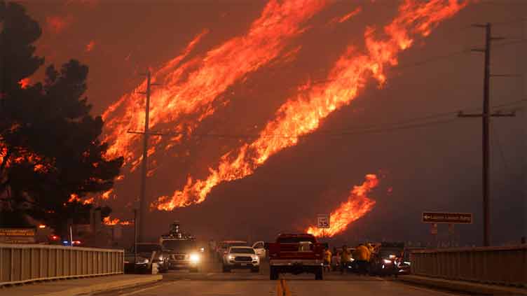 New wildfire near Los Angeles explodes to 9,400 acres, forces evacuations