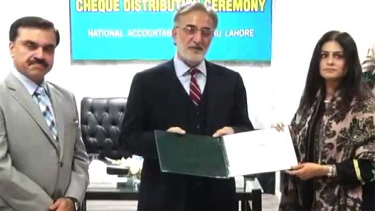 NAB chairman distributes plots, cheques among affectees