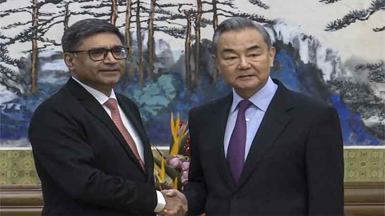 Chinese and Indian diplomats call for warmer relations but make no public mention of border dispute