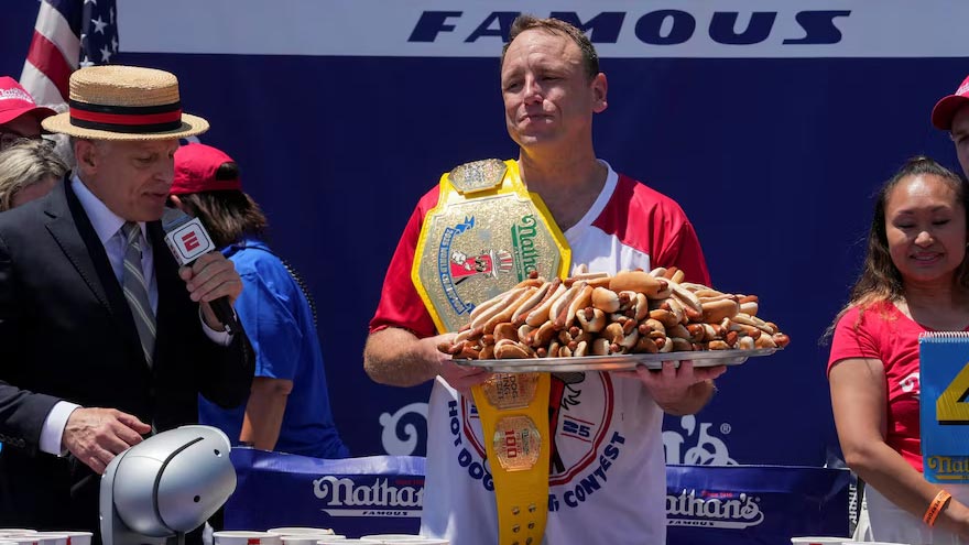 Longtime champion Joey Chestnut downs 71 hot dogs to reclaim title
