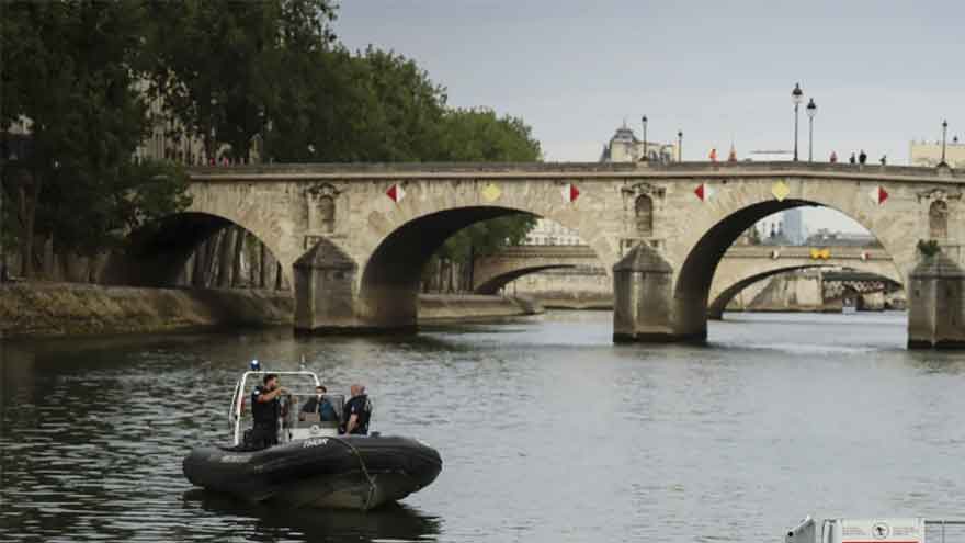 Joyful Parisians take a historic plunge into the Seine after 100 years