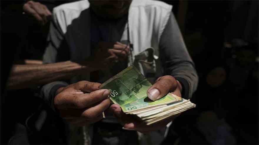 To get their own cash, people in Gaza must pay middlemen a 40% cut