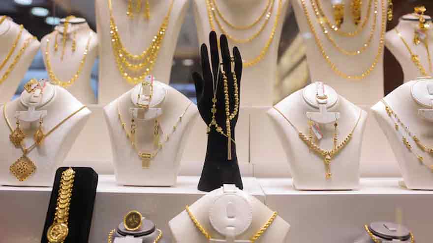 Gold prices scale three-week peak as Trump widens trade war