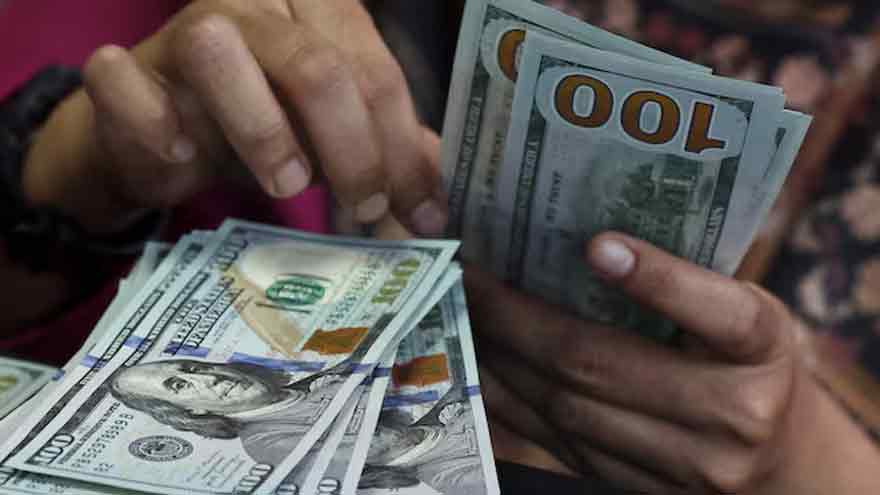 Dollar holds near 3-week high before CPI