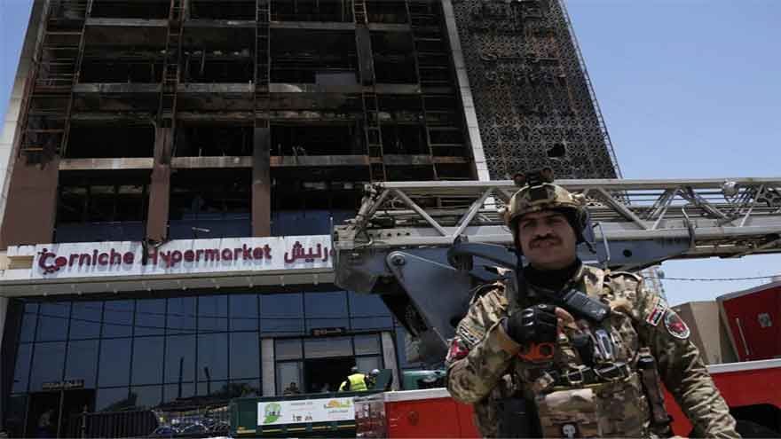 Officials try to identify 18 bodies in deadly Iraq shopping mall fire