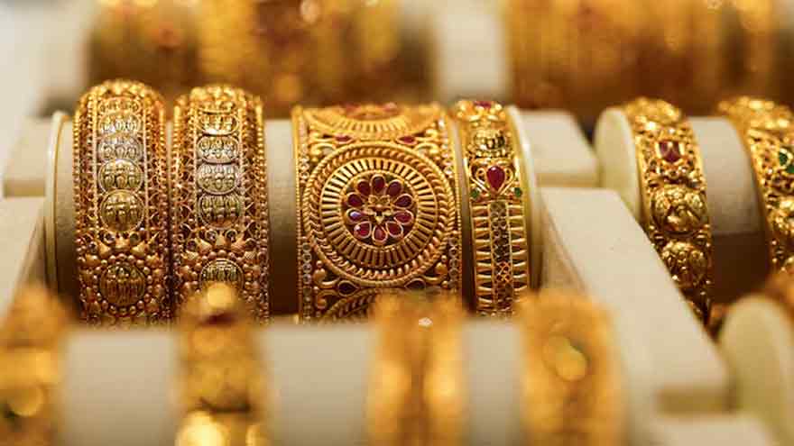 Gold inches higher on lower Treasury yields; Fed policy decision awaited