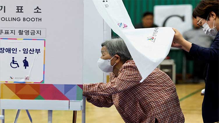 Millions of South Koreans vote in presidential poll overshadowed by martial law crisis