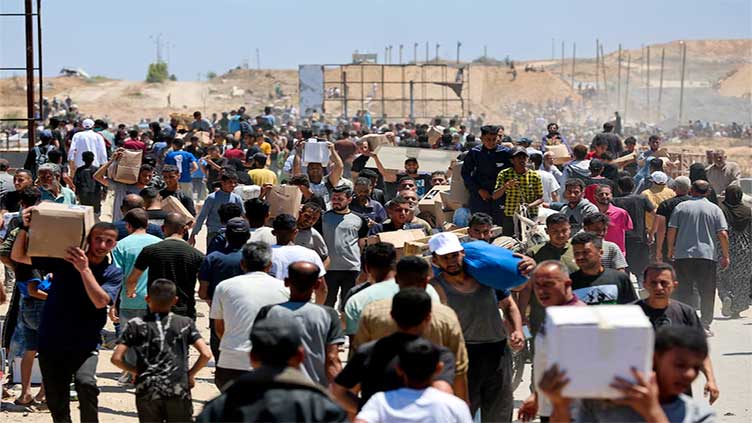 American group distributing aid in Gaza delays reopening sites