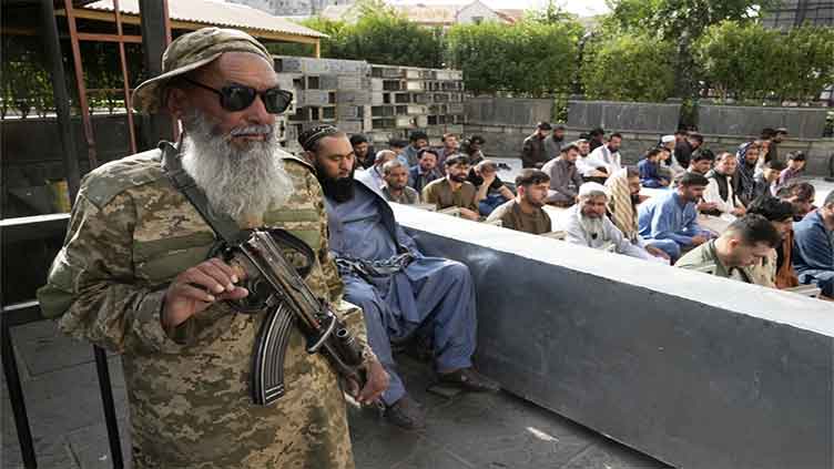 A top Taliban official offers amnesty to Afghans who fled the country and urges them to return