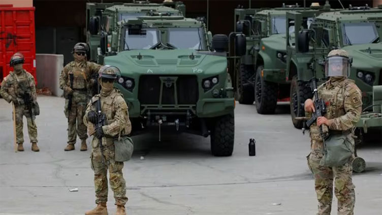 National Guard deploys in LA as Trump warns of 'troops everywhere'