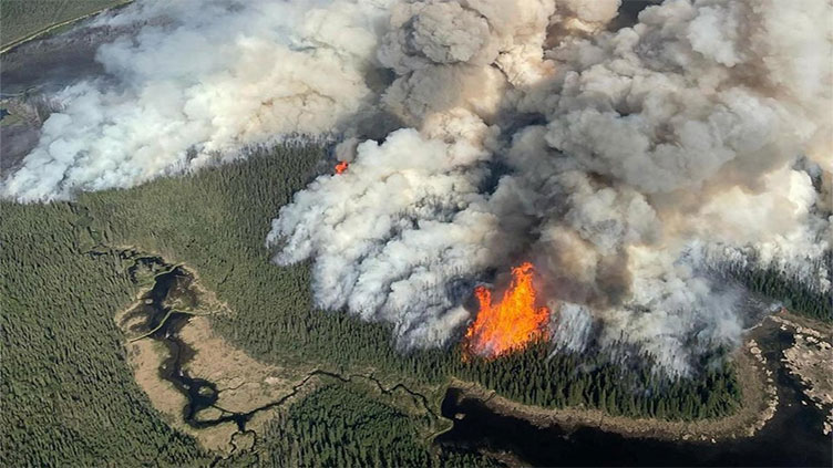 Military aids evacuations as Canada wildfires expand eastward