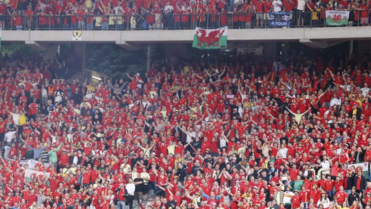 Wales fan hospitalised after fall from stands during Belgium match