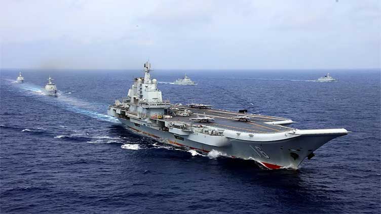 Two Chinese aircraft carriers seen in Pacific for first time, Japan says