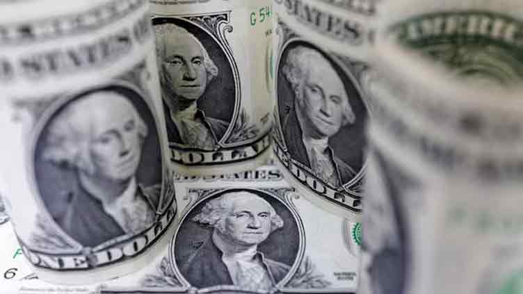 Dollar slides on easing trade tensions, Fed expectations