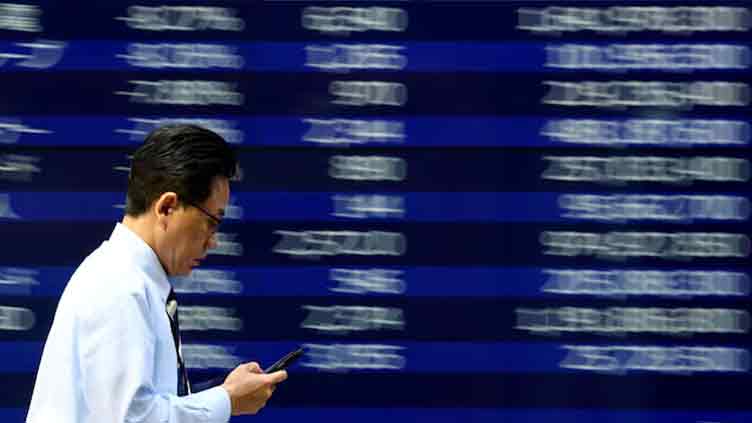 Stocks show resilience in Asia as oil gains