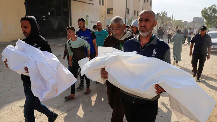 Israeli tanks kill 59 people in Gaza crowd trying to get food aid, medics say