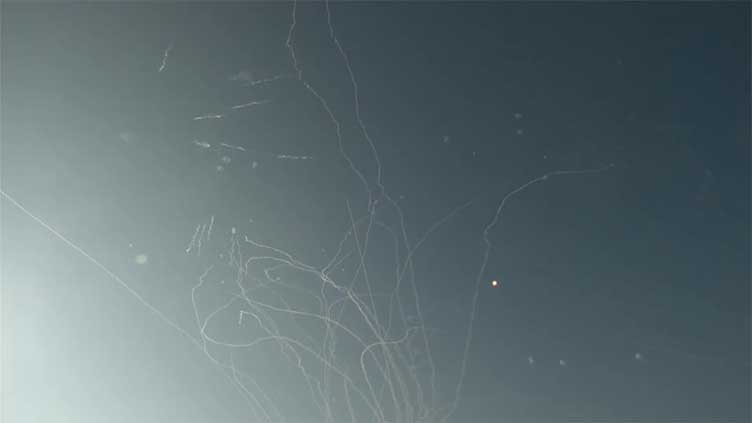 Smoke trails seen above Tel Aviv as sirens blare, blasts heard