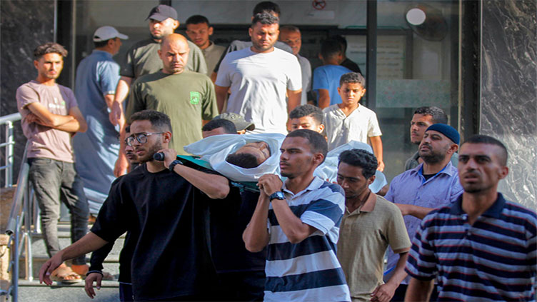 Gaza rescuers say Israeli forces kill 60, half near aid centres