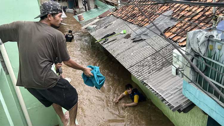 Hundreds evacuated as torrential rains flood Indonesia capital