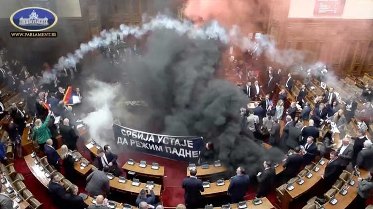 Smoke grenades tossed in Serbian parliament, lawmaker suffers stroke