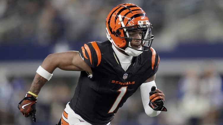 Chase, Higgins reach extensions with Bengals. AP source says Chase will be NFL's highest-paid non-QB